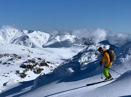 Backcountry skier skiing down the slopes